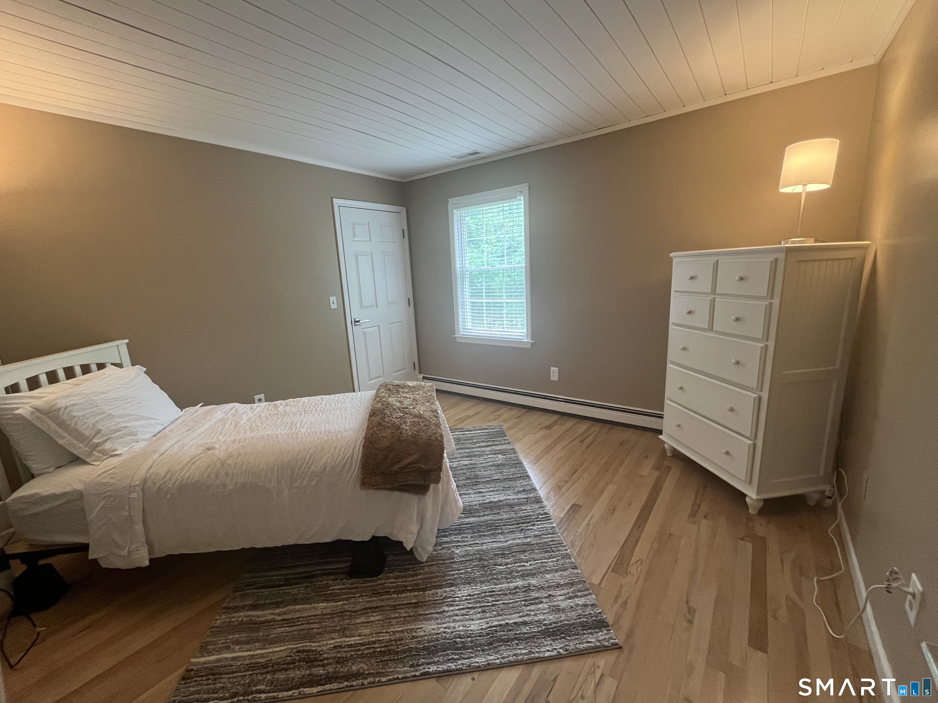 47 Merwin Brook Road Brookfield, CT 06804 - Photo 17 of 29 a bedroom with a bed and wooden floor