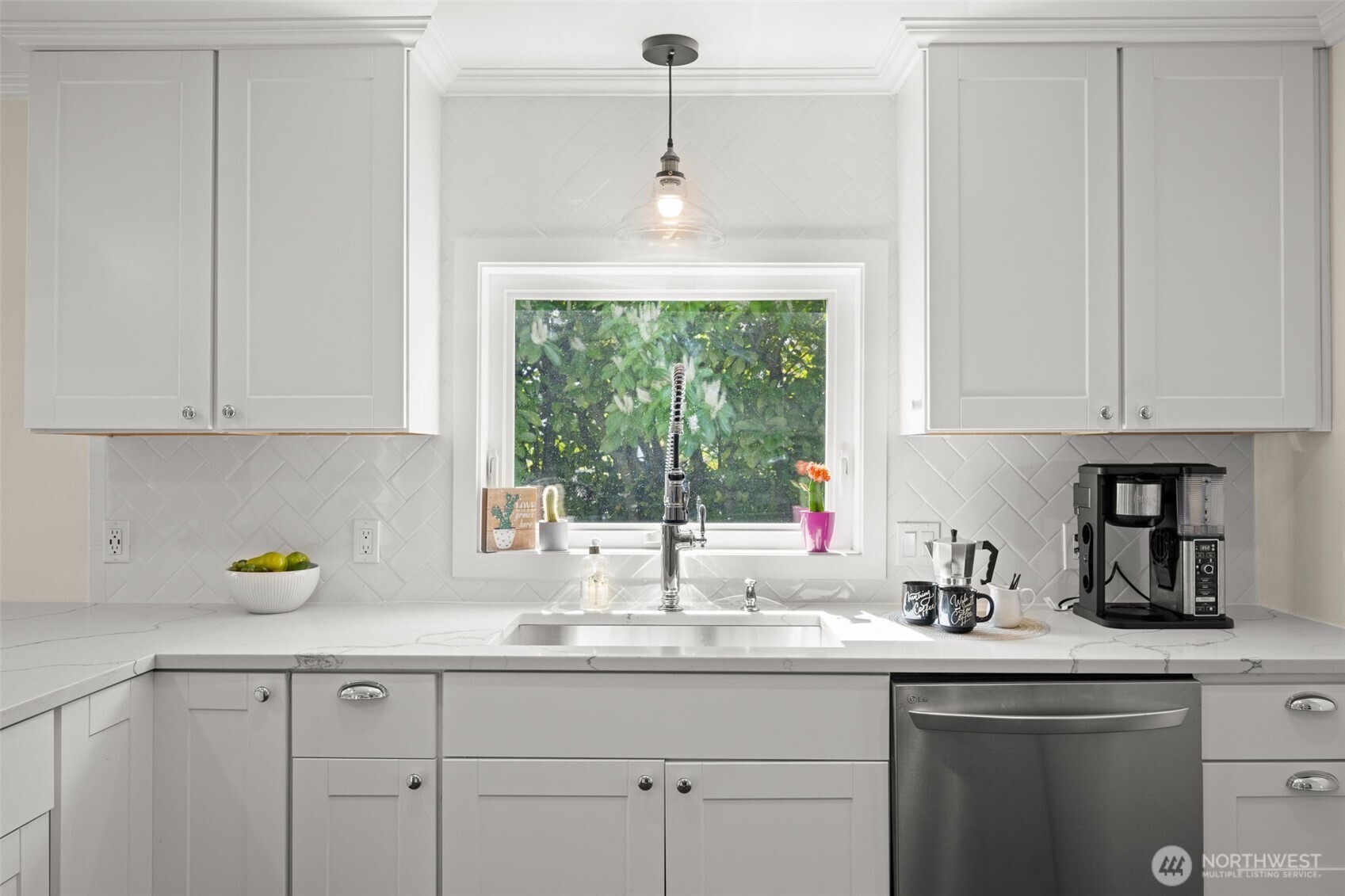 1928 Virginia Avenue Everett, WA 98201 - Photo 12 of 40 a kitchen with stainless steel appliances granite countertop a sink a window and cabinets