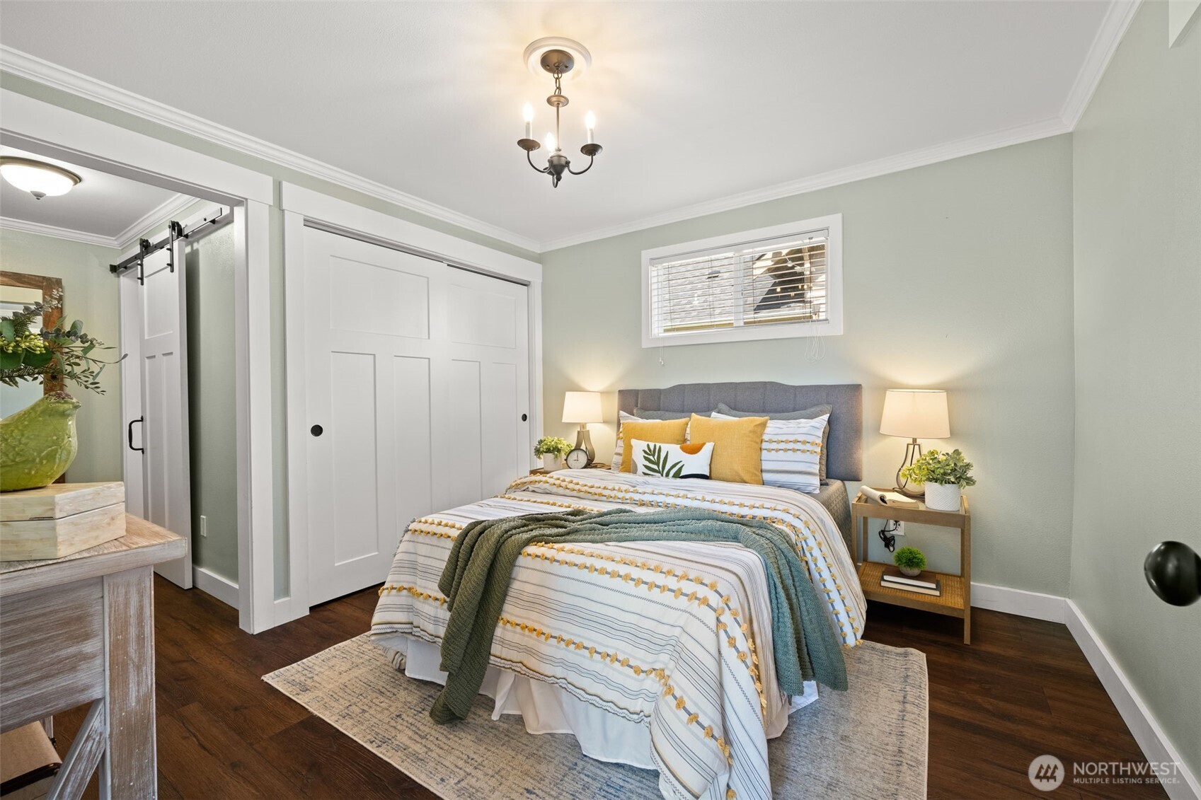 1928 Virginia Avenue Everett, WA 98201 - Photo 14 of 40 a bedroom with a bed and a chandelier