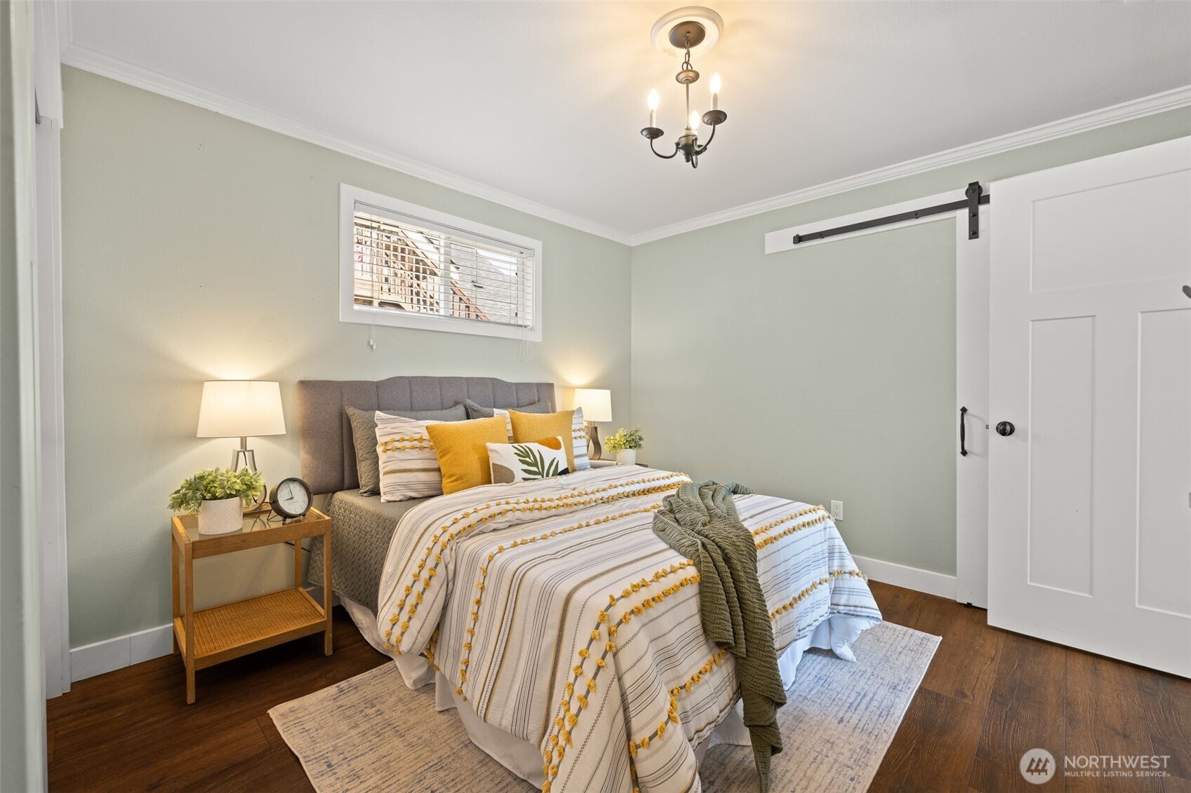 1928 Virginia Avenue Everett, WA 98201 - Photo 15 of 40 a bedroom with a bed and wooden floor