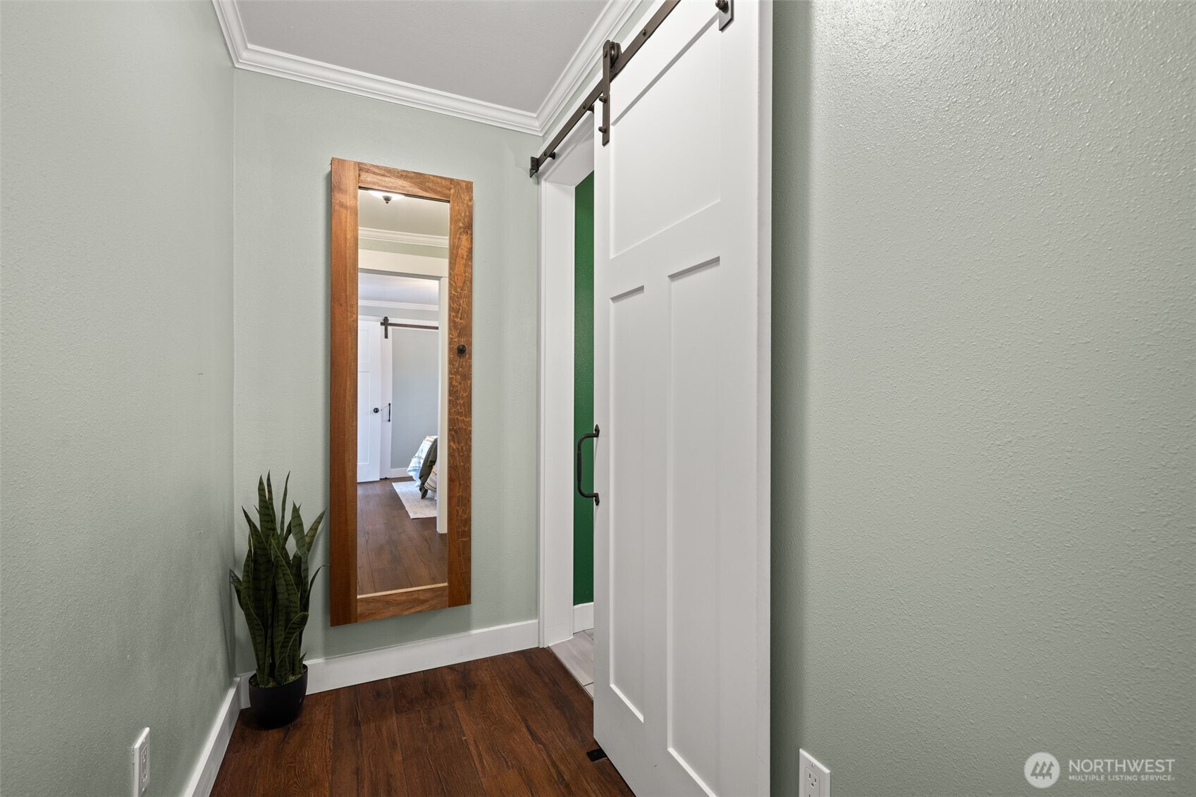 1928 Virginia Avenue Everett, WA 98201 - Photo 16 of 40 a view of a hallway with wooden floor and a bathroom