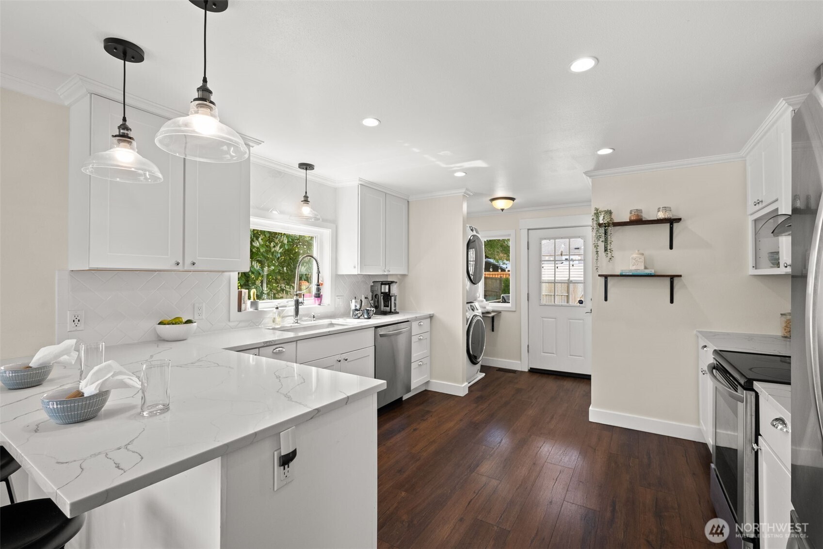 1928 Virginia Avenue Everett, WA 98201 - Photo 10 of 40 a kitchen with white cabinets and white appliances