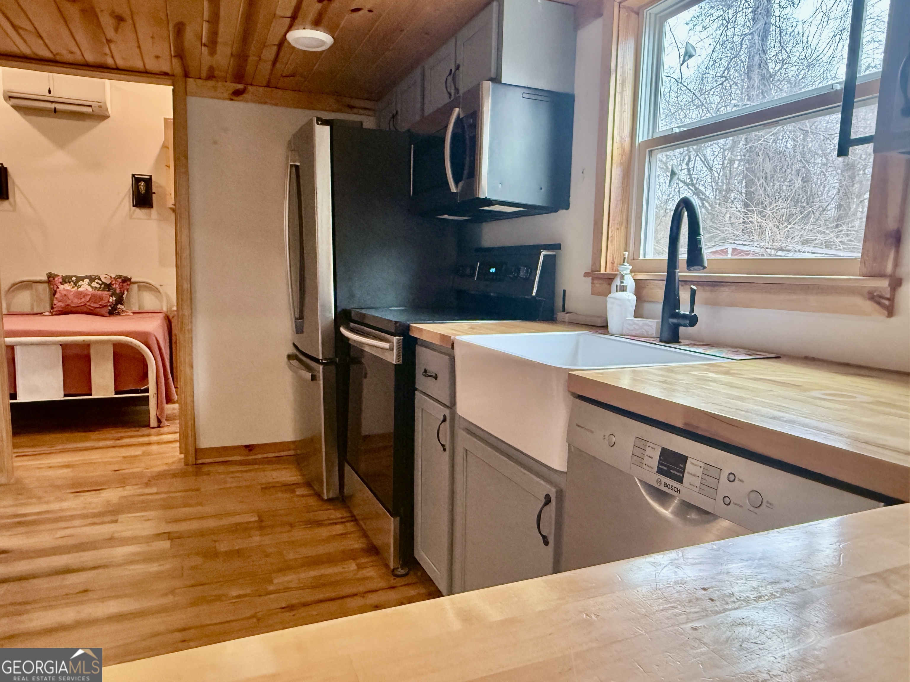 168 Ellenburg Subdivision Summerville, GA 30747 - Photo 13 of 24 a kitchen with stainless steel appliances granite countertop a sink and a refrigerator