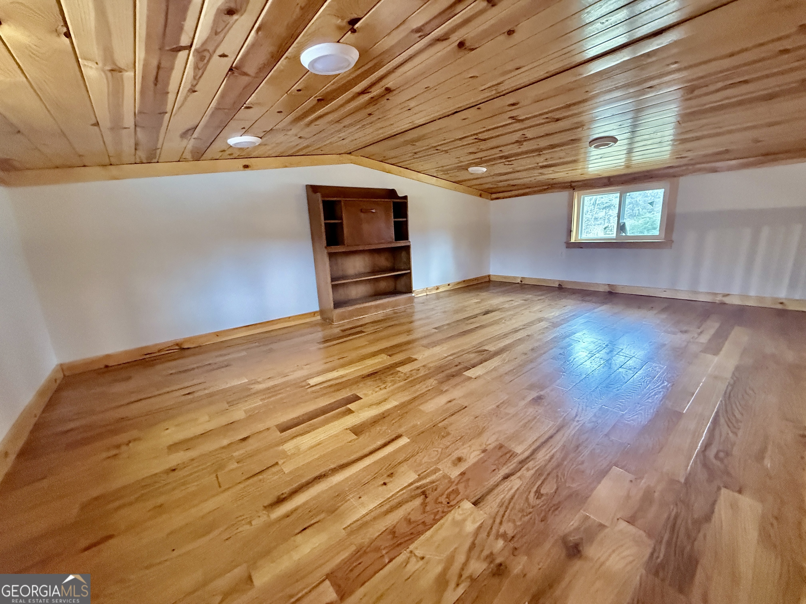 168 Ellenburg Subdivision Summerville, GA 30747 - Photo 17 of 24 a view of empty room with wooden floor and fan