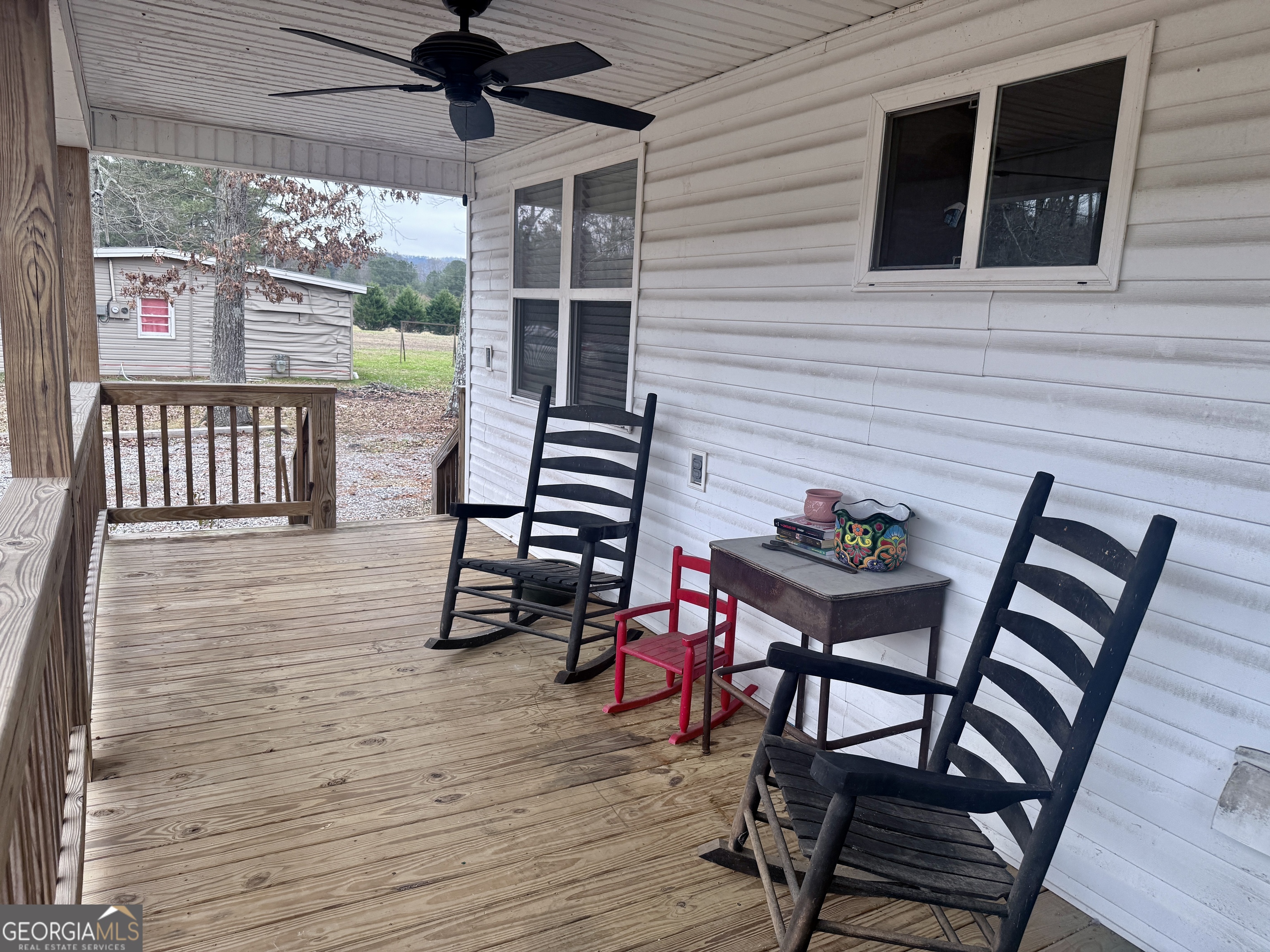 168 Ellenburg Subdivision Summerville, GA 30747 - Photo 3 of 24 a view of a chairs and table in a patio
