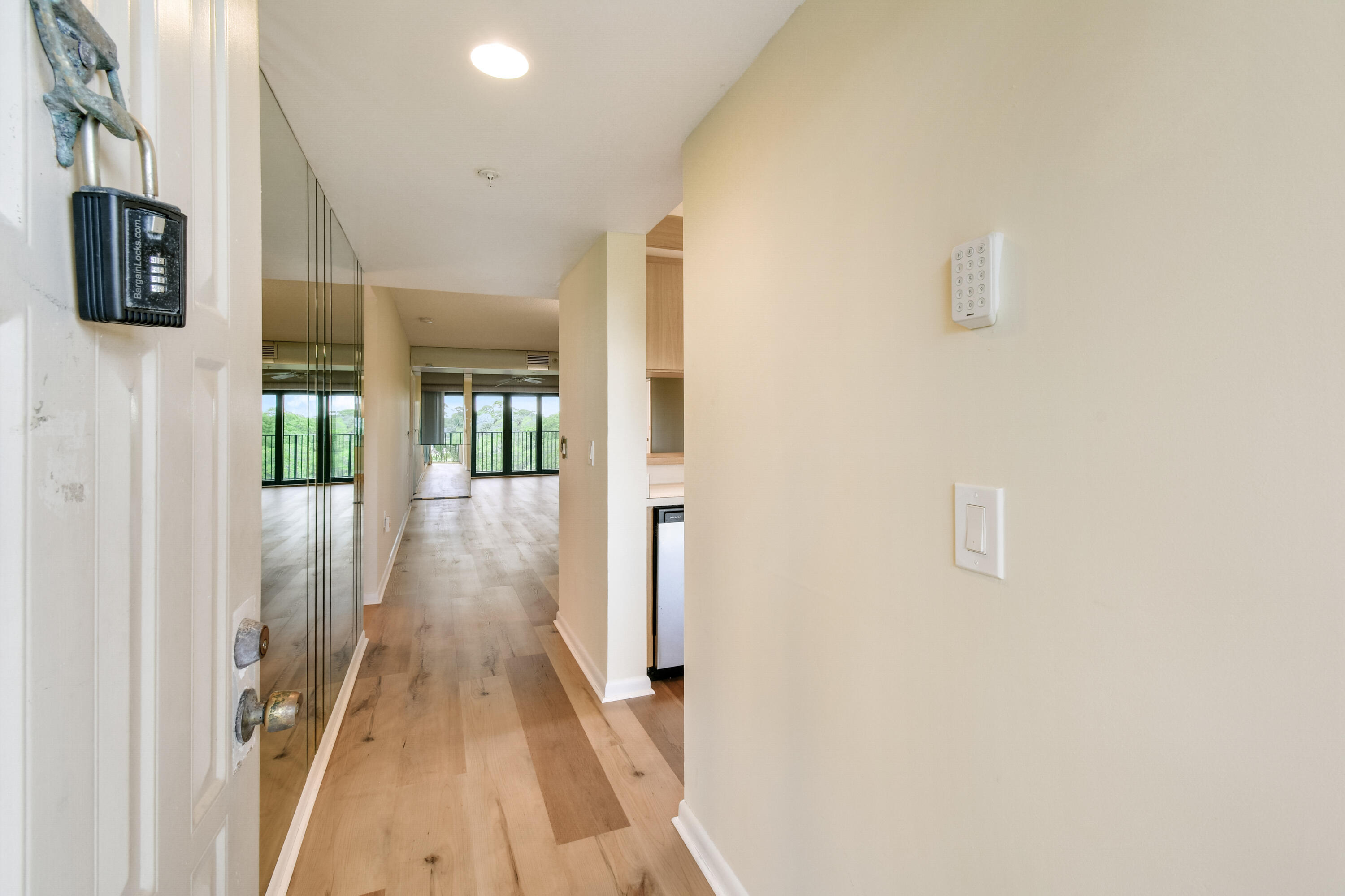 1701 Marina Isle Way, Unit 301 Jupiter, FL 33477 - Photo 14 of 60 a view of a hallway with wooden floor and staircase