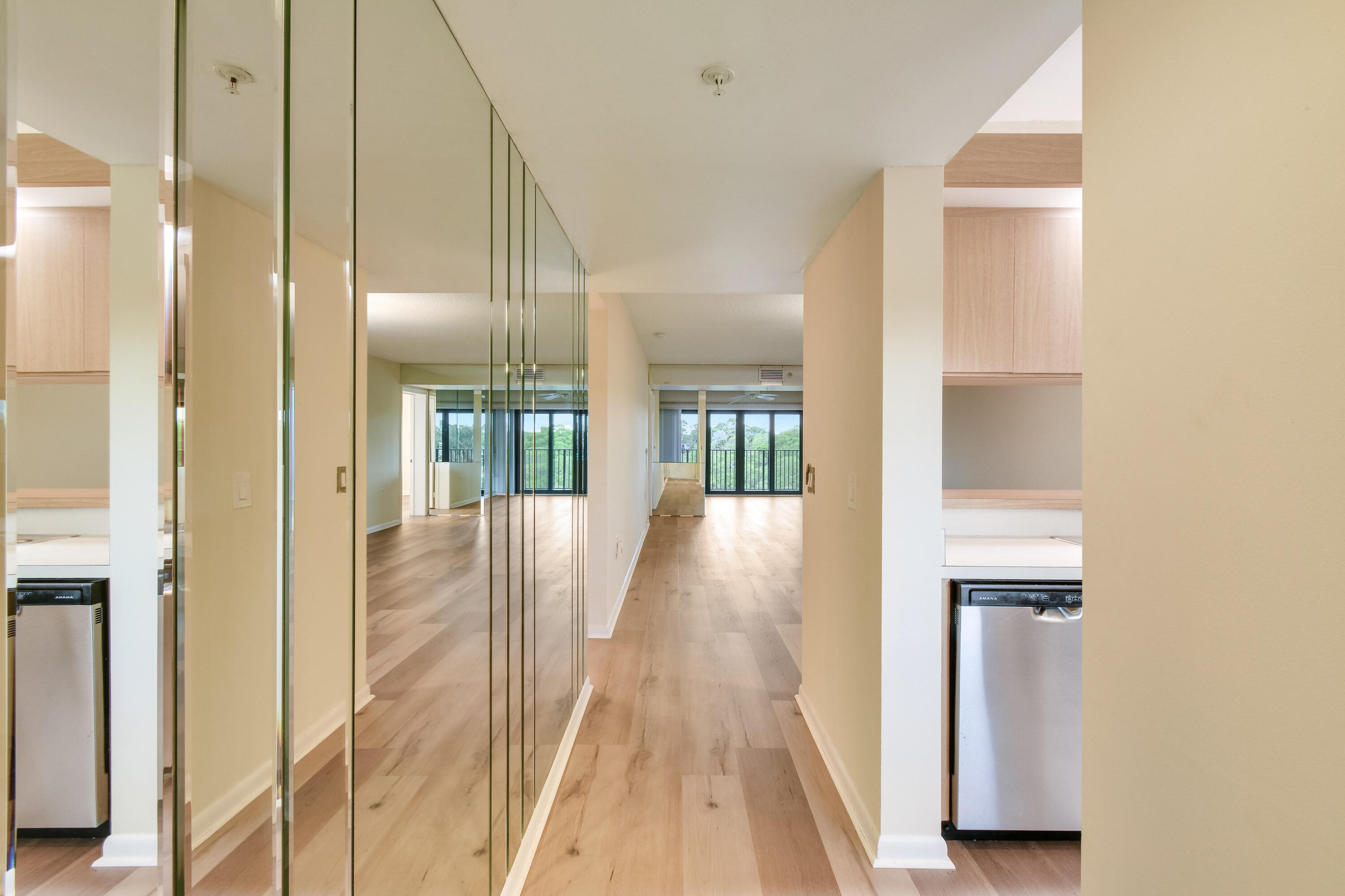 1701 Marina Isle Way, Unit 301 Jupiter, FL 33477 - Photo 15 of 60 a view of a hallway with wooden floor and staircase