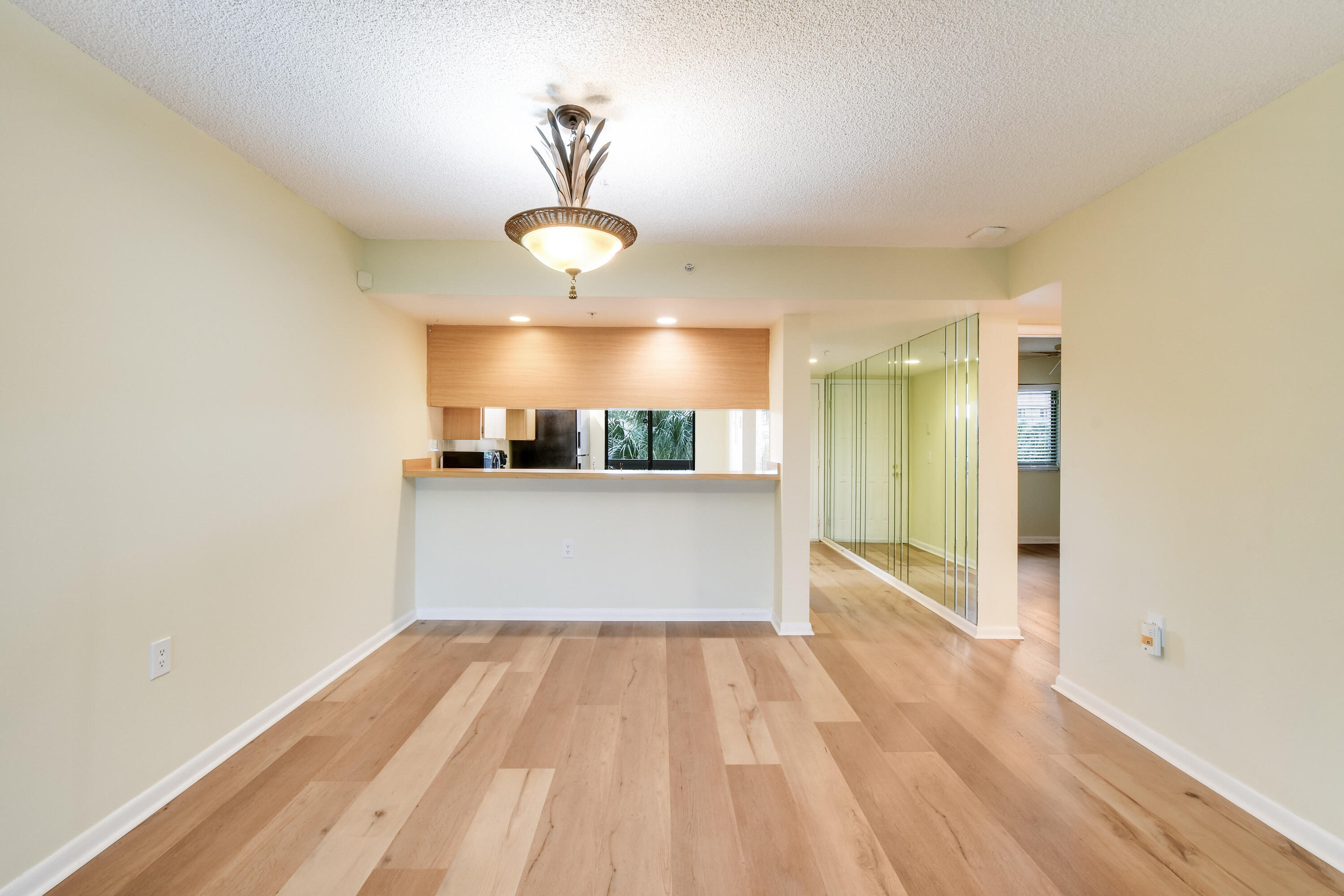 1701 Marina Isle Way, Unit 301 Jupiter, FL 33477 - Photo 17 of 60 a view of a room with wooden floor and window
