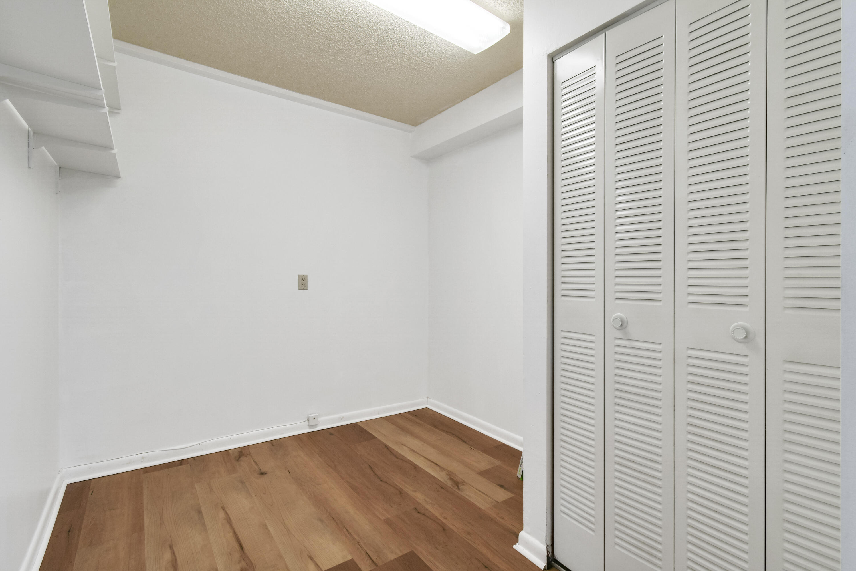 1701 Marina Isle Way, Unit 301 Jupiter, FL 33477 - Photo 31 of 60 a view of a room with wooden floor
