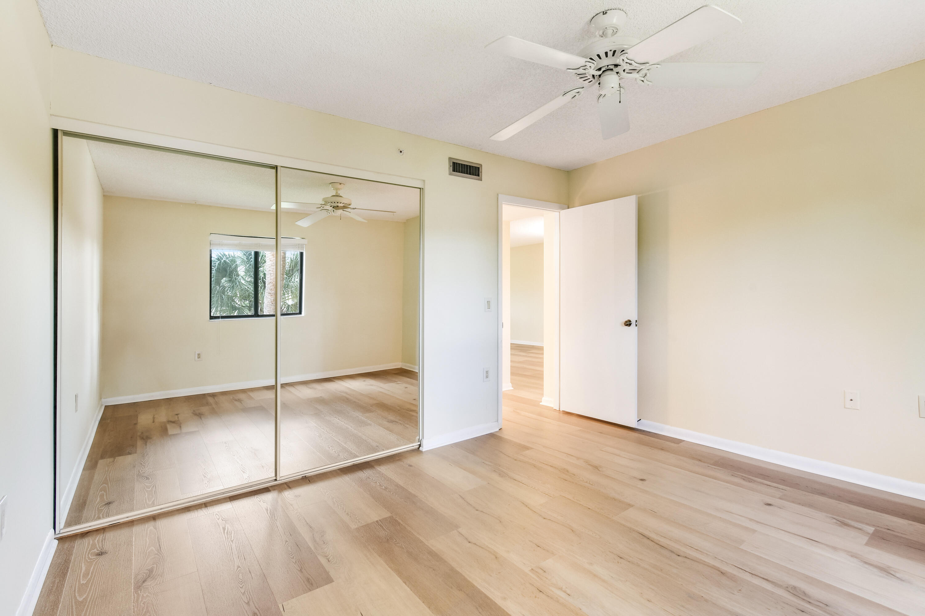1701 Marina Isle Way, Unit 301 Jupiter, FL 33477 - Photo 37 of 60 a view of an empty room with a window