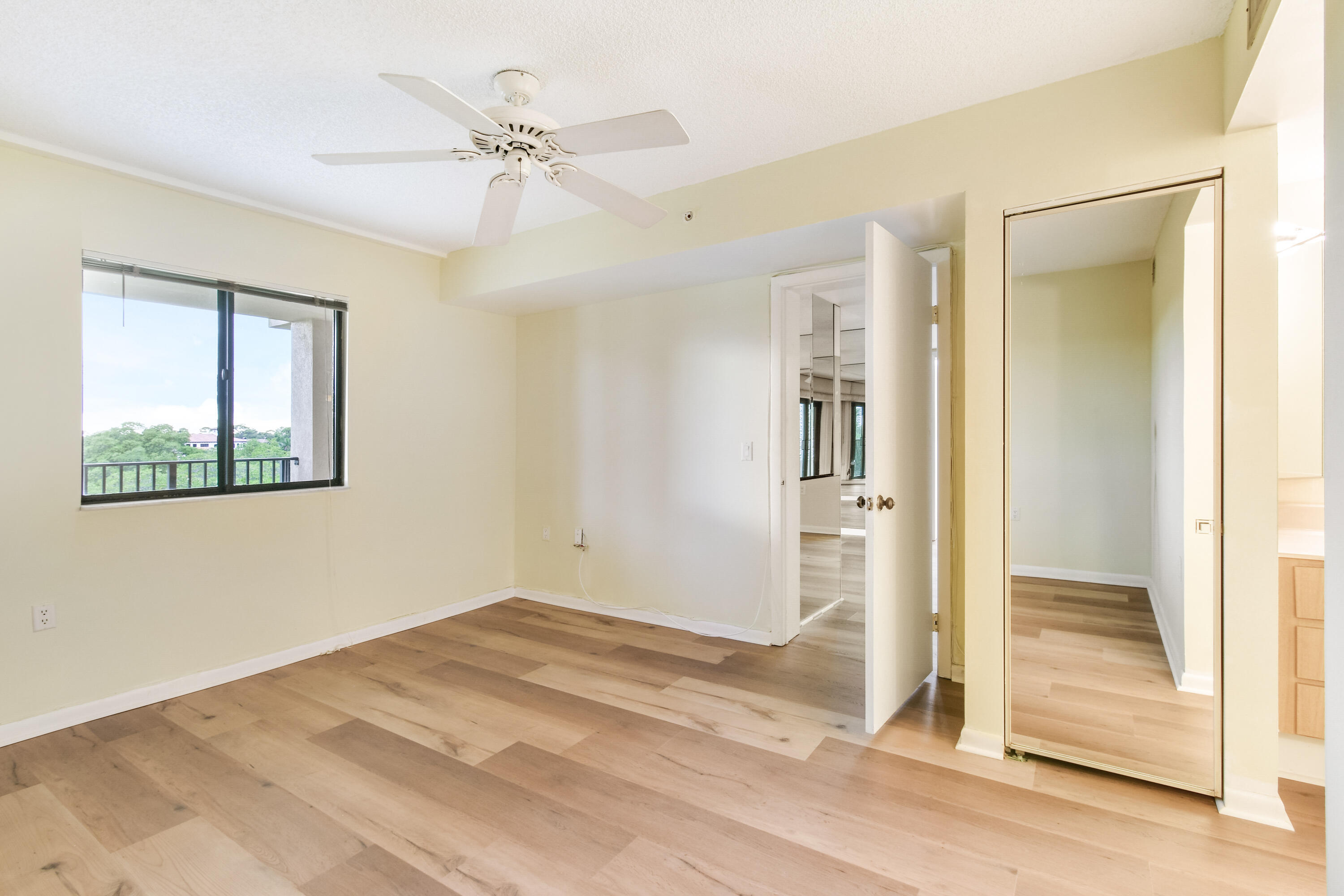 1701 Marina Isle Way, Unit 301 Jupiter, FL 33477 - Photo 38 of 60 wooden floor in an empty room with a window