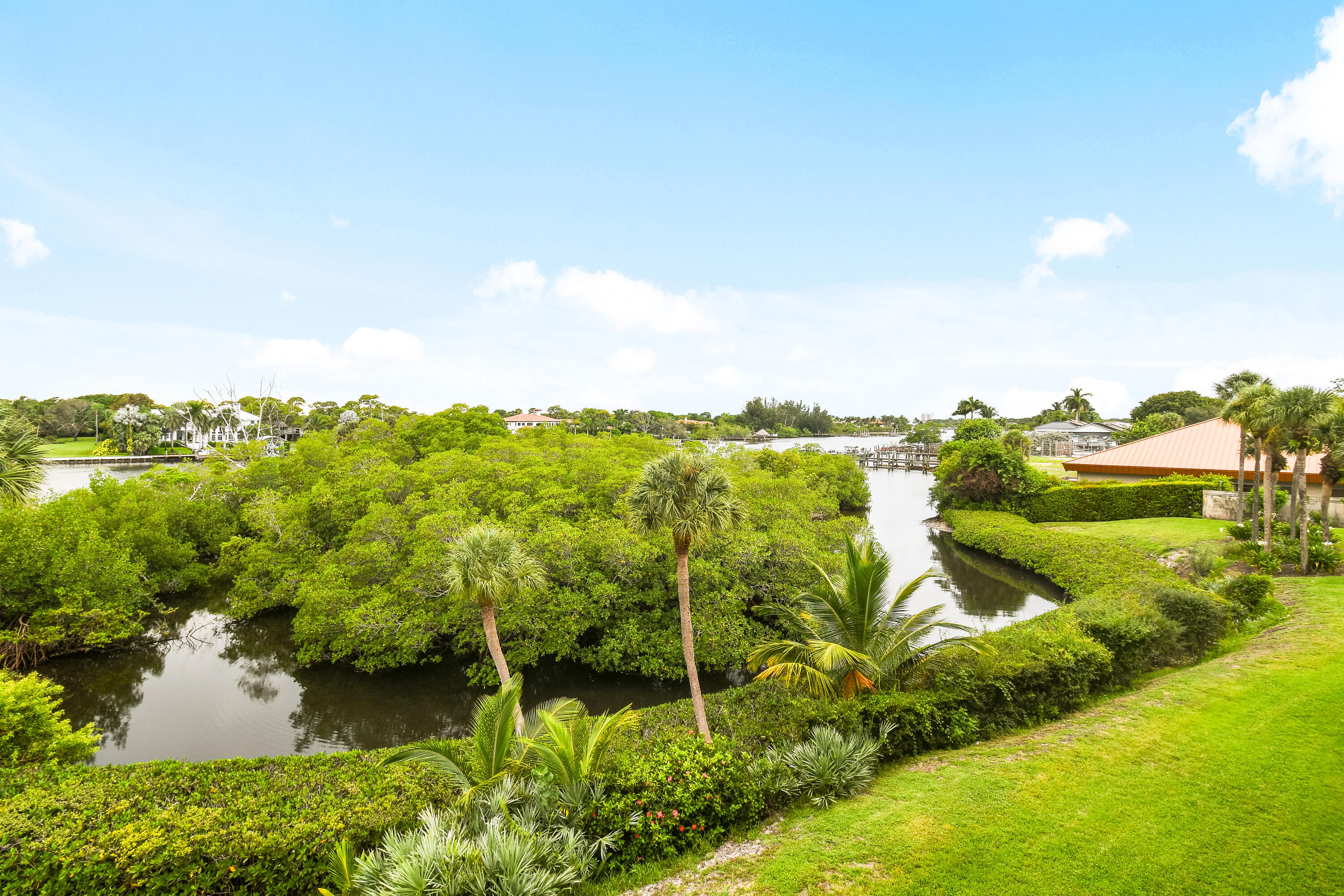 1701 Marina Isle Way, Unit 301 Jupiter, FL 33477 - Photo 45 of 60 a view of a lake with houses in the back