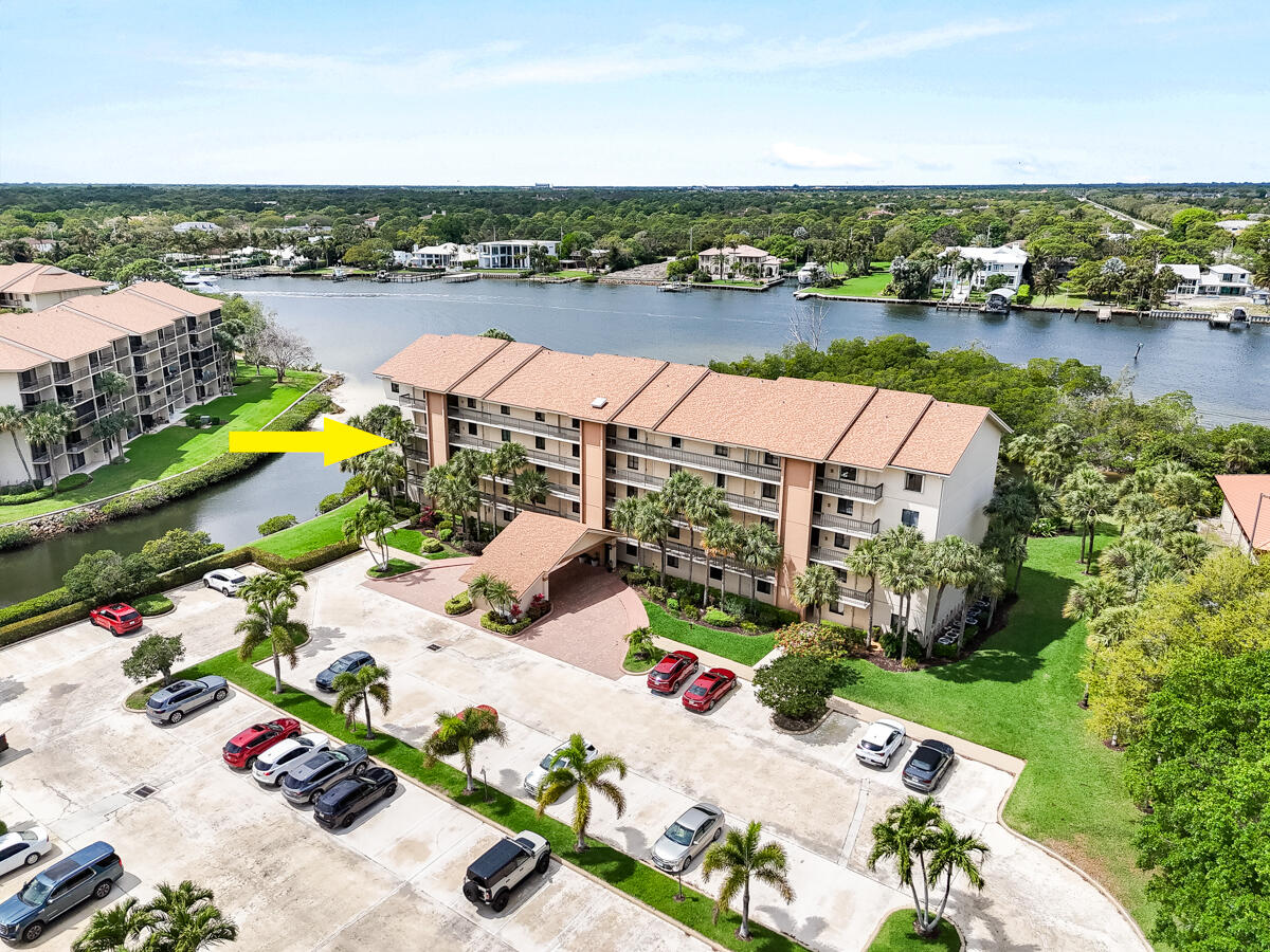 1701 Marina Isle Way, Unit 301 Jupiter, FL 33477 - Photo 47 of 60 an aerial view of lake and residential houses with outdoor space
