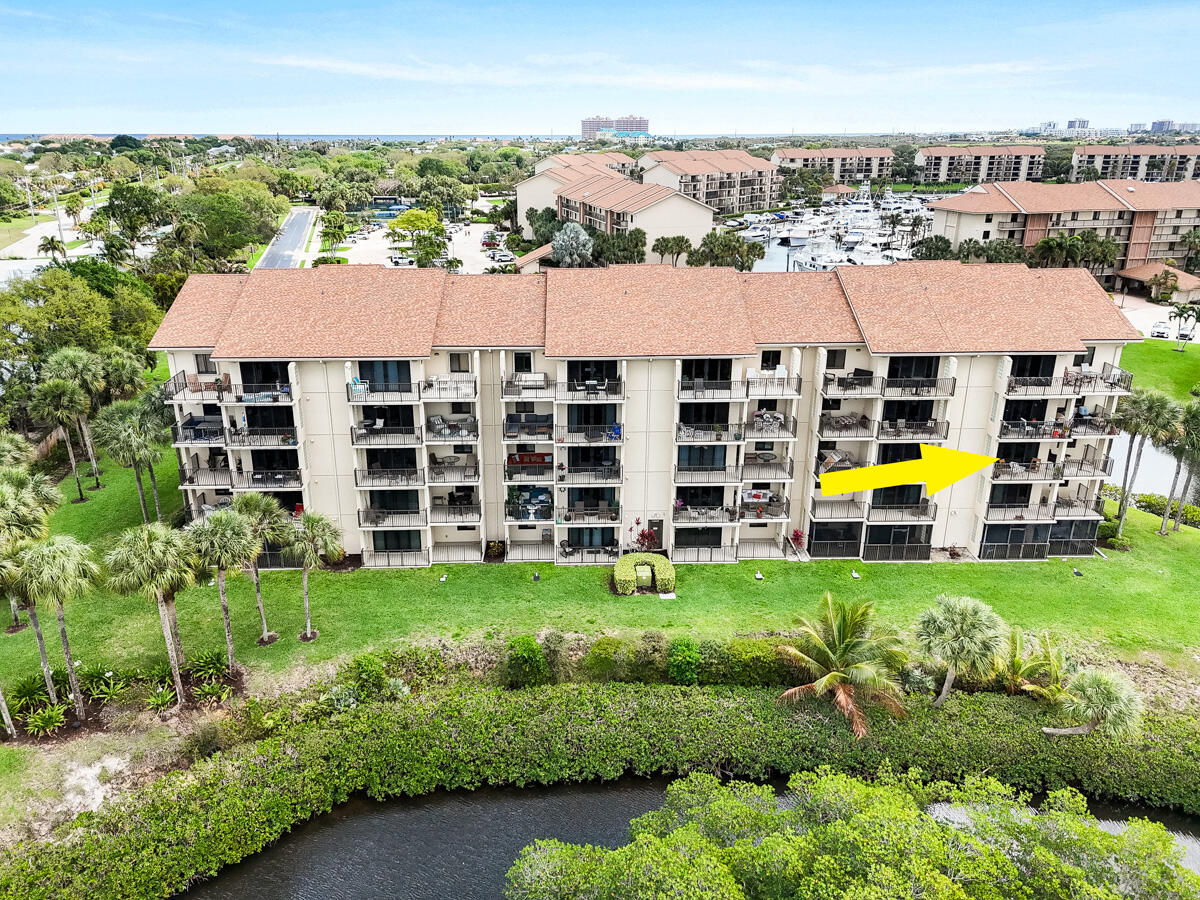 1701 Marina Isle Way, Unit 301 Jupiter, FL 33477 - Photo 54 of 60 a view of a city that has tall buildings and a big yard