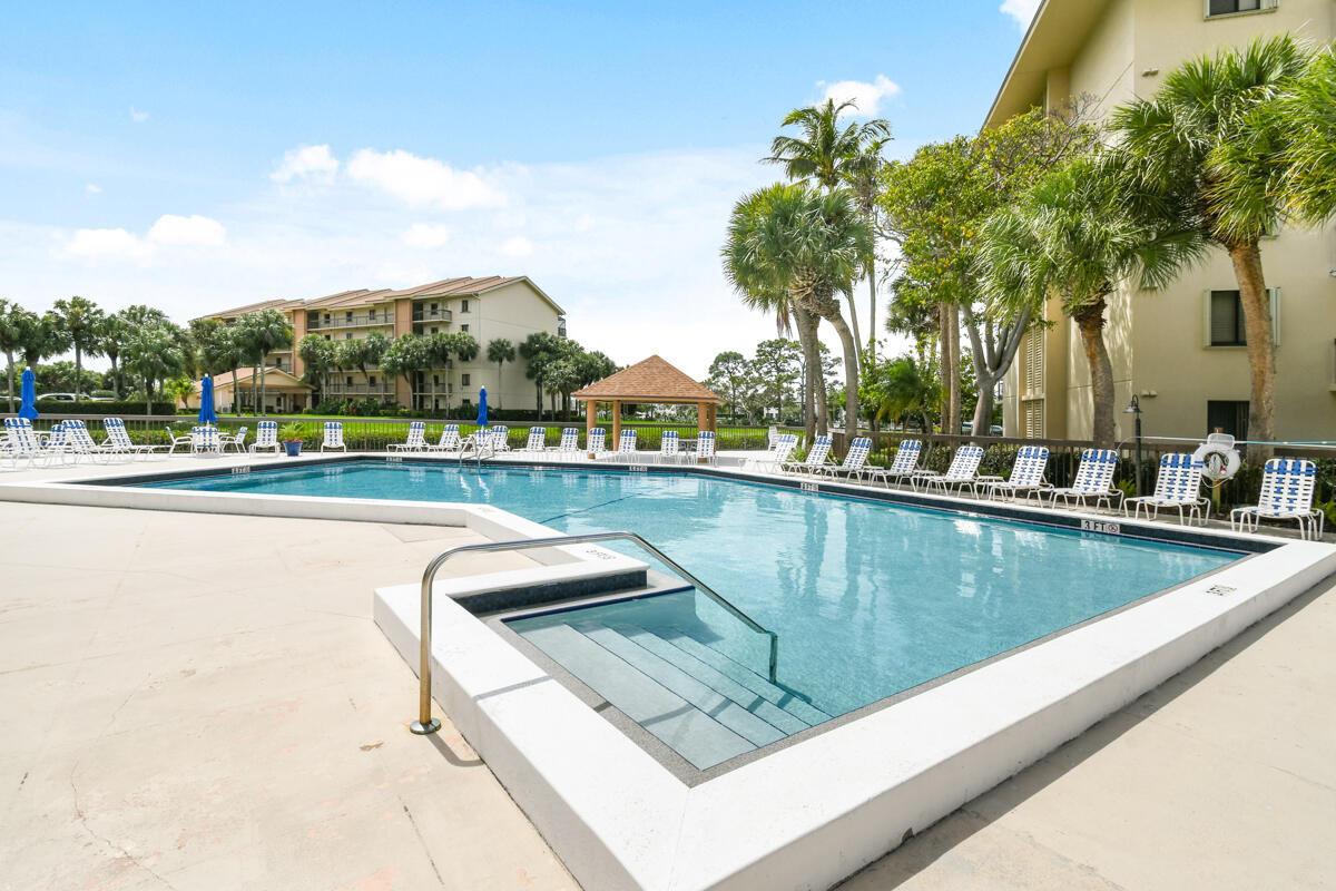1701 Marina Isle Way, Unit 301 Jupiter, FL 33477 - Photo 57 of 60 a view of swimming pool with a terrace
