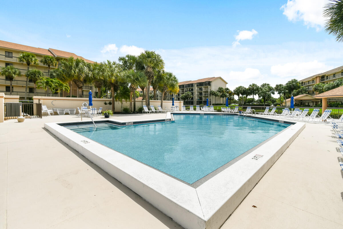 1701 Marina Isle Way, Unit 301 Jupiter, FL 33477 - Photo 59 of 60 a view of a swimming pool with a terrace