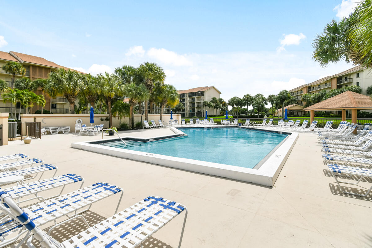1701 Marina Isle Way, Unit 301 Jupiter, FL 33477 - Photo 60 of 60 a view of a swimming pool with a patio