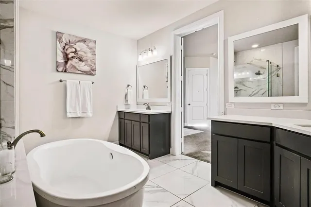 a bathroom with a bathtub and a sink