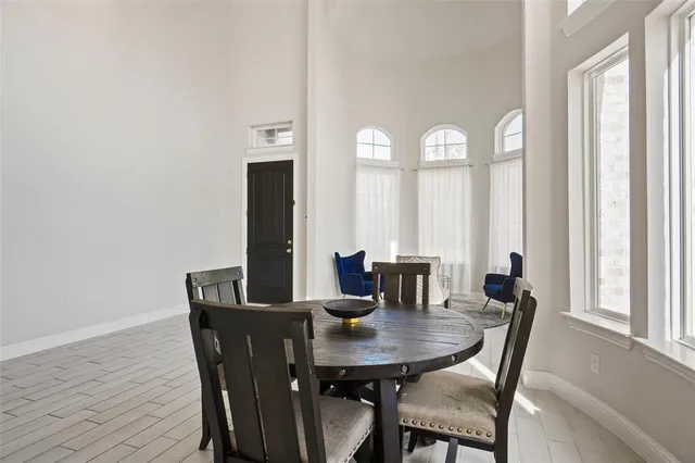 a view of a dining room with furniture and window