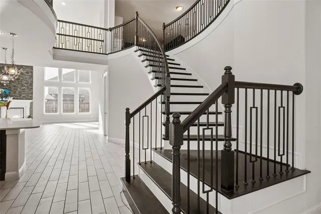 a view of entryway with wooden floor and stairs