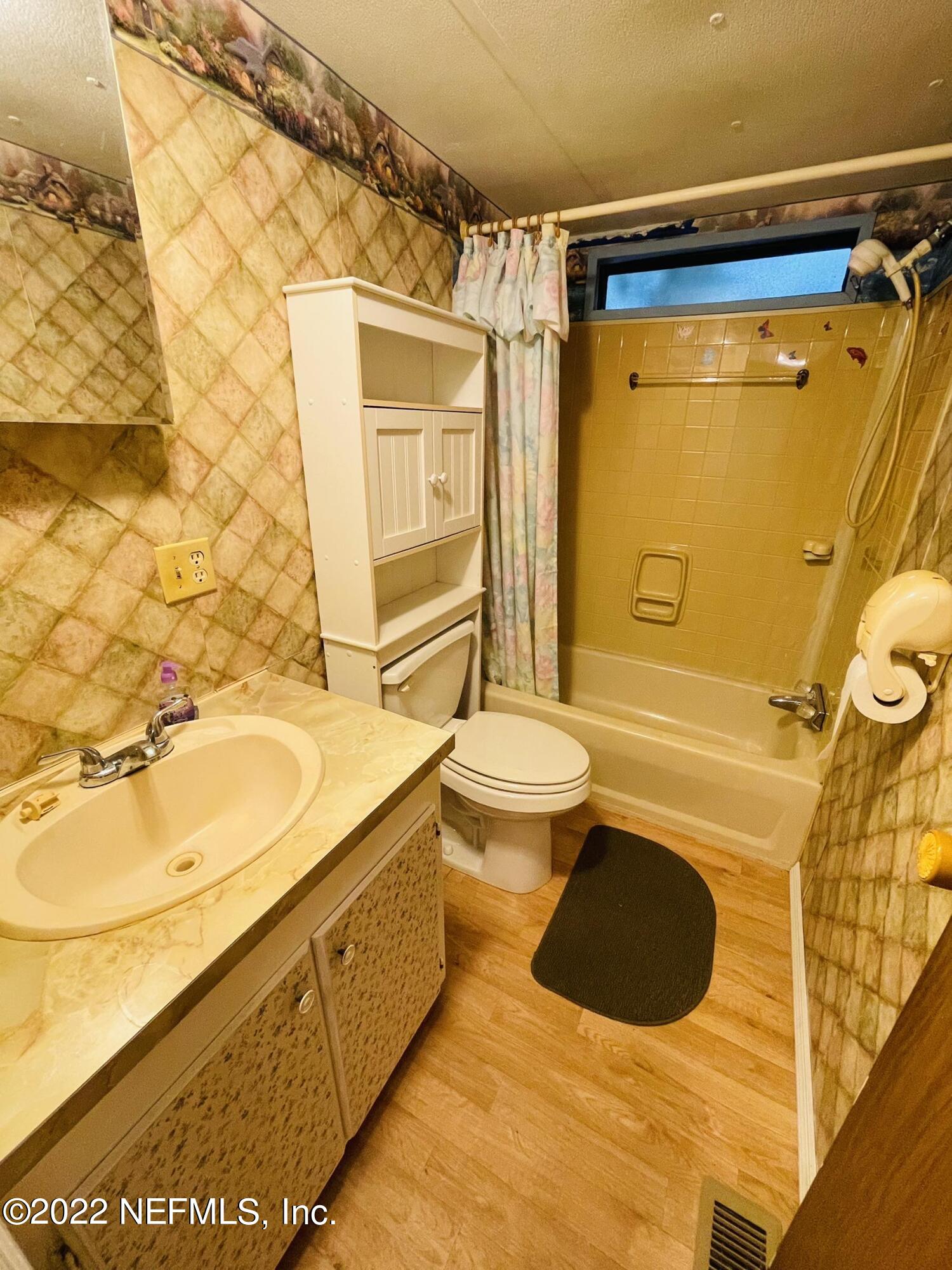 121 Crows Bluff Road Satsuma, FL 32189 - Photo 13 of 14 a bathroom with a sink toilet and shower