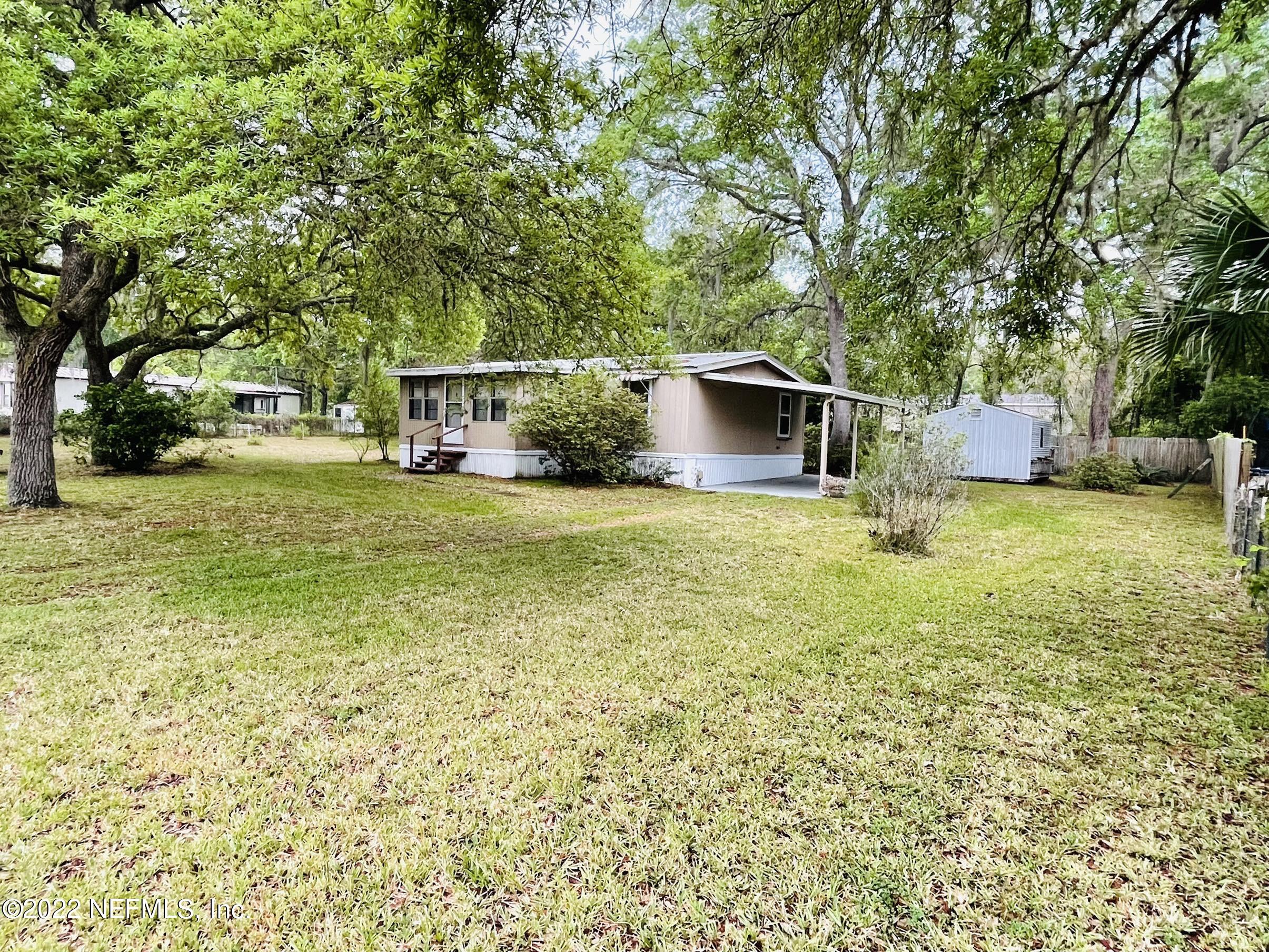 121 Crows Bluff Road Satsuma, FL 32189 - Photo 2 of 14 a view of a house with a yard and sitting area