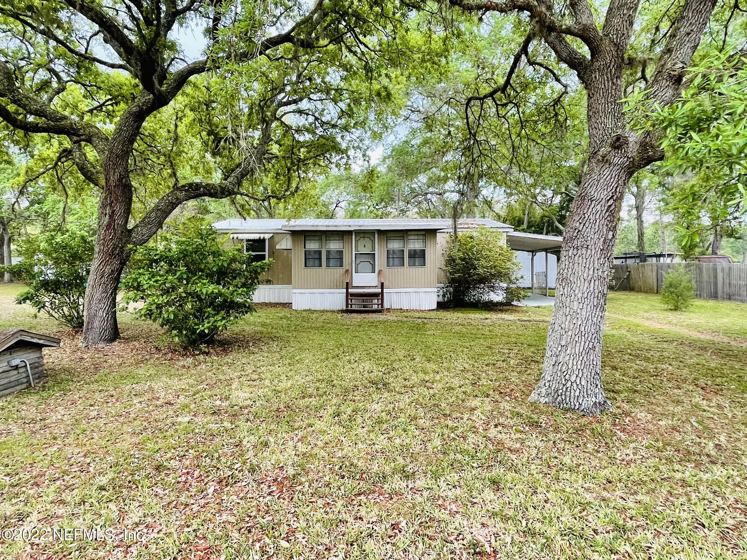 121 Crows Bluff Road Satsuma, FL 32189 - Photo 3 of 14 a view of a house with a yard