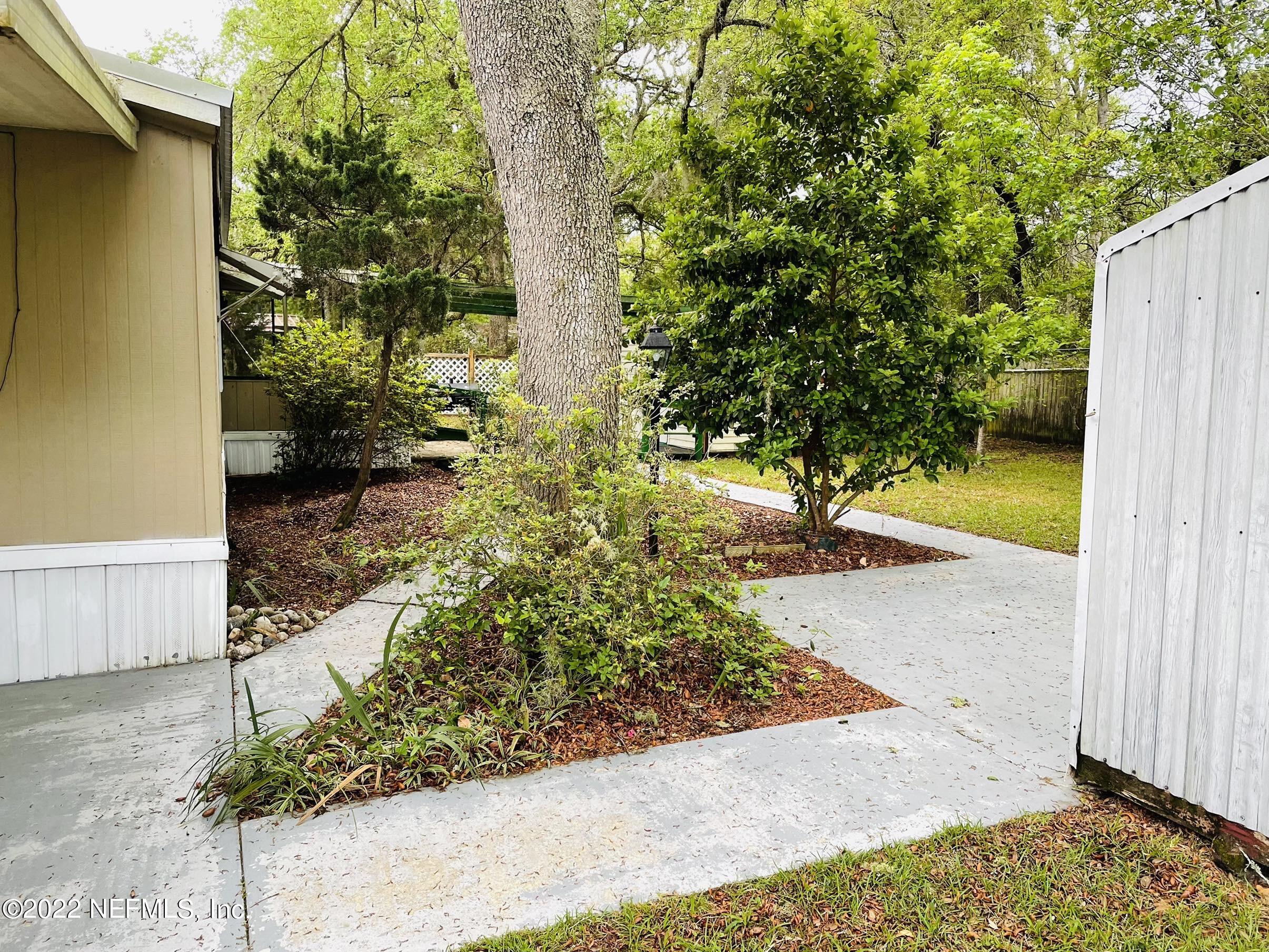 121 Crows Bluff Road Satsuma, FL 32189 - Photo 5 of 14 a view of a yard with potted plants