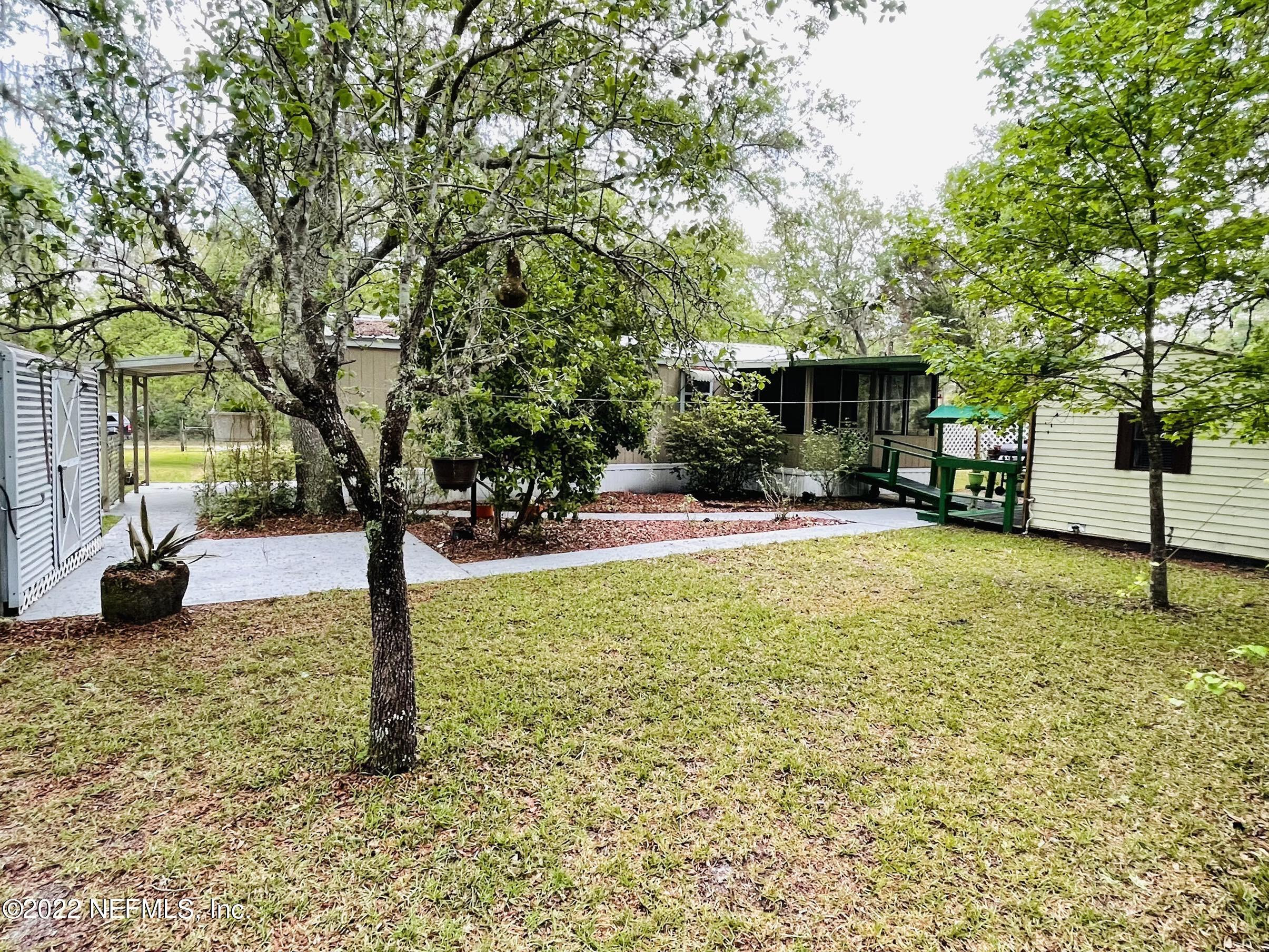 121 Crows Bluff Road Satsuma, FL 32189 - Photo 6 of 14 a view of a house with a yard
