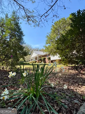 a front view of a house with a yard and porch