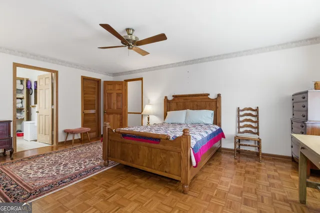 a bedroom with bed and a window