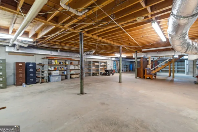 a living room with furniture windows and a chandelier