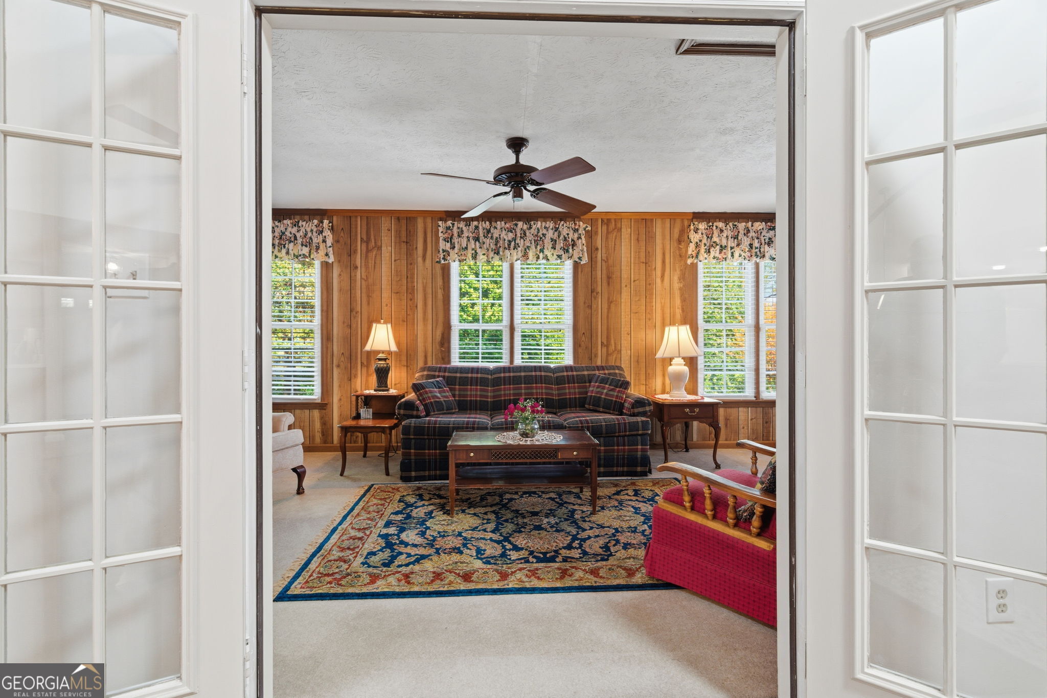 91 Almond Road LaGrange, GA 30241 - Photo 21 of 46 a living room with furniture windows and a chandelier
