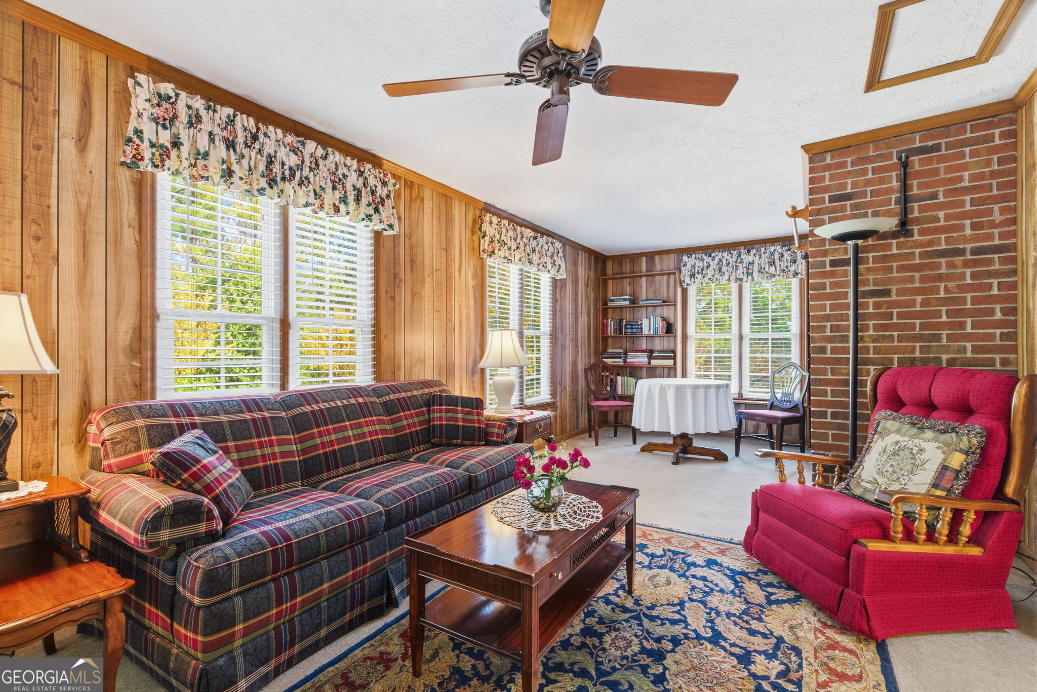 91 Almond Road LaGrange, GA 30241 - Photo 24 of 46 a living room with furniture and a floor to ceiling window