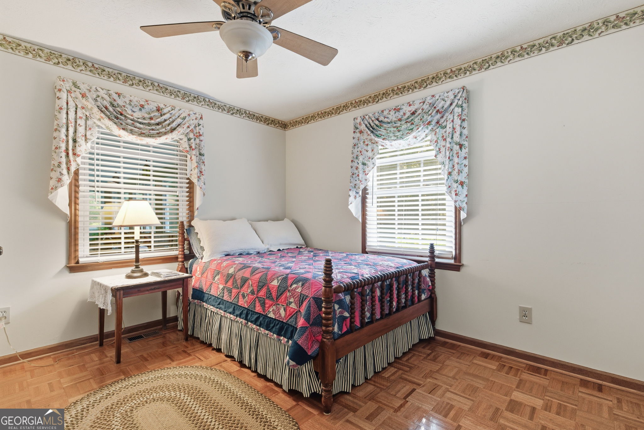 91 Almond Road LaGrange, GA 30241 - Photo 28 of 46 a bed sitting in a bedroom next to a window and a chandelier