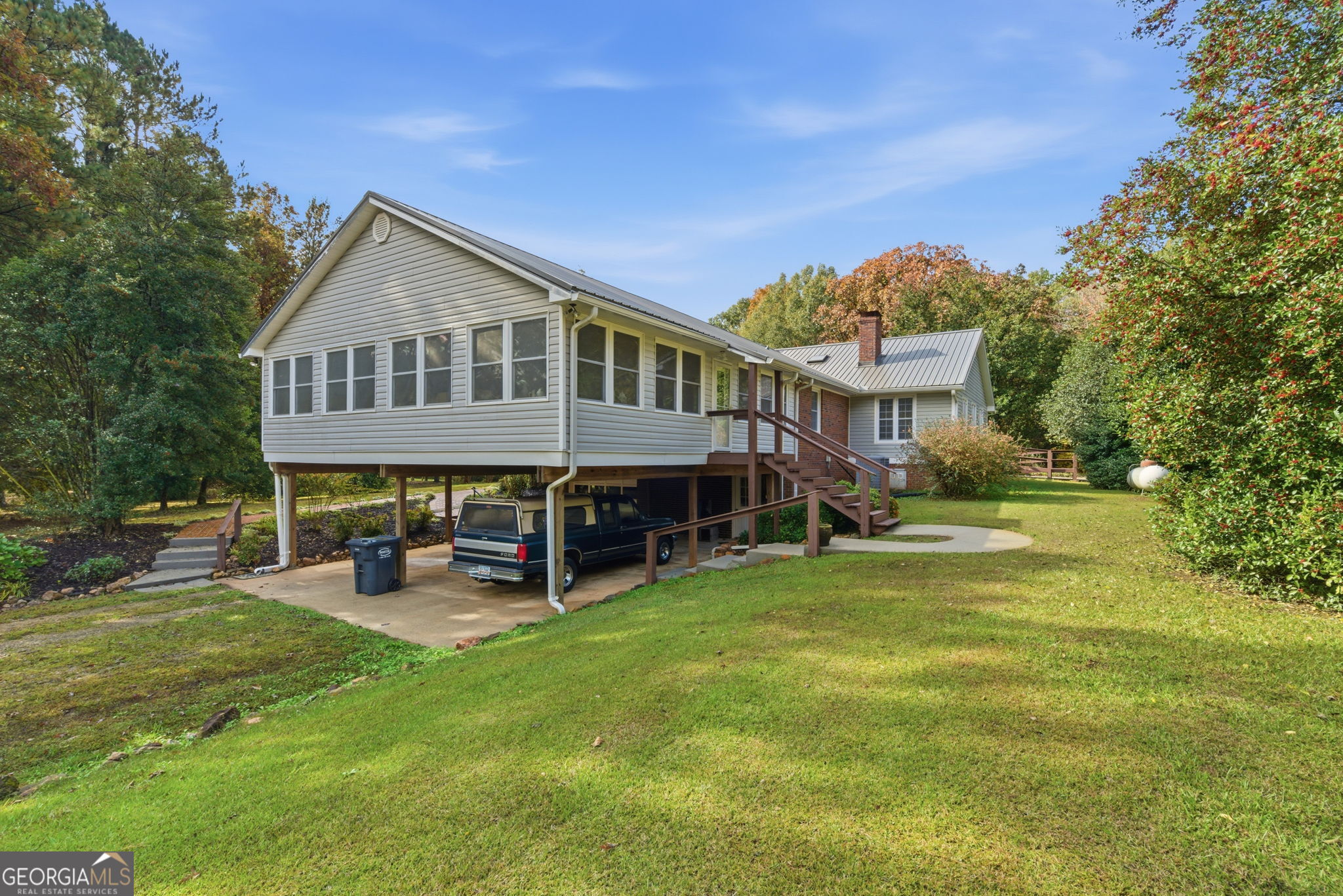 91 Almond Road LaGrange, GA 30241 - Photo 29 of 46 a view of a house with a patio and a yard