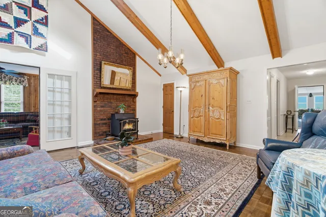 a view of a house with a yard and tree s