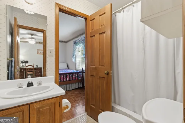 a view of a room with wooden floor