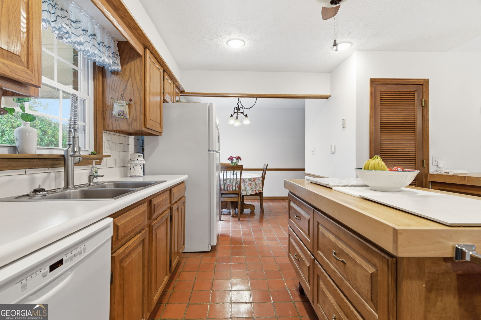 91 Almond Road LaGrange, GA 30241 - Photo 39 of 46 a kitchen with a sink stove and cabinets