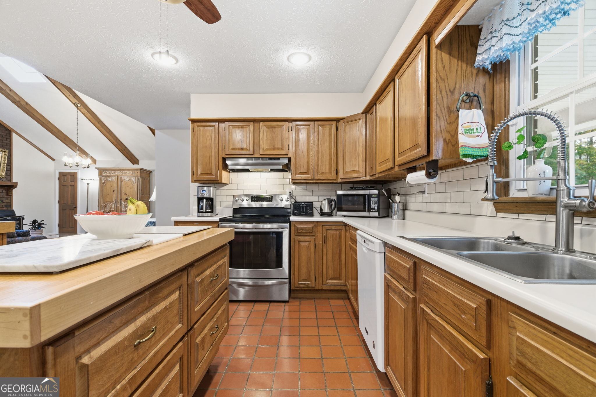 91 Almond Road LaGrange, GA 30241 - Photo 41 of 46 a kitchen with stainless steel appliances a sink stove and cabinets