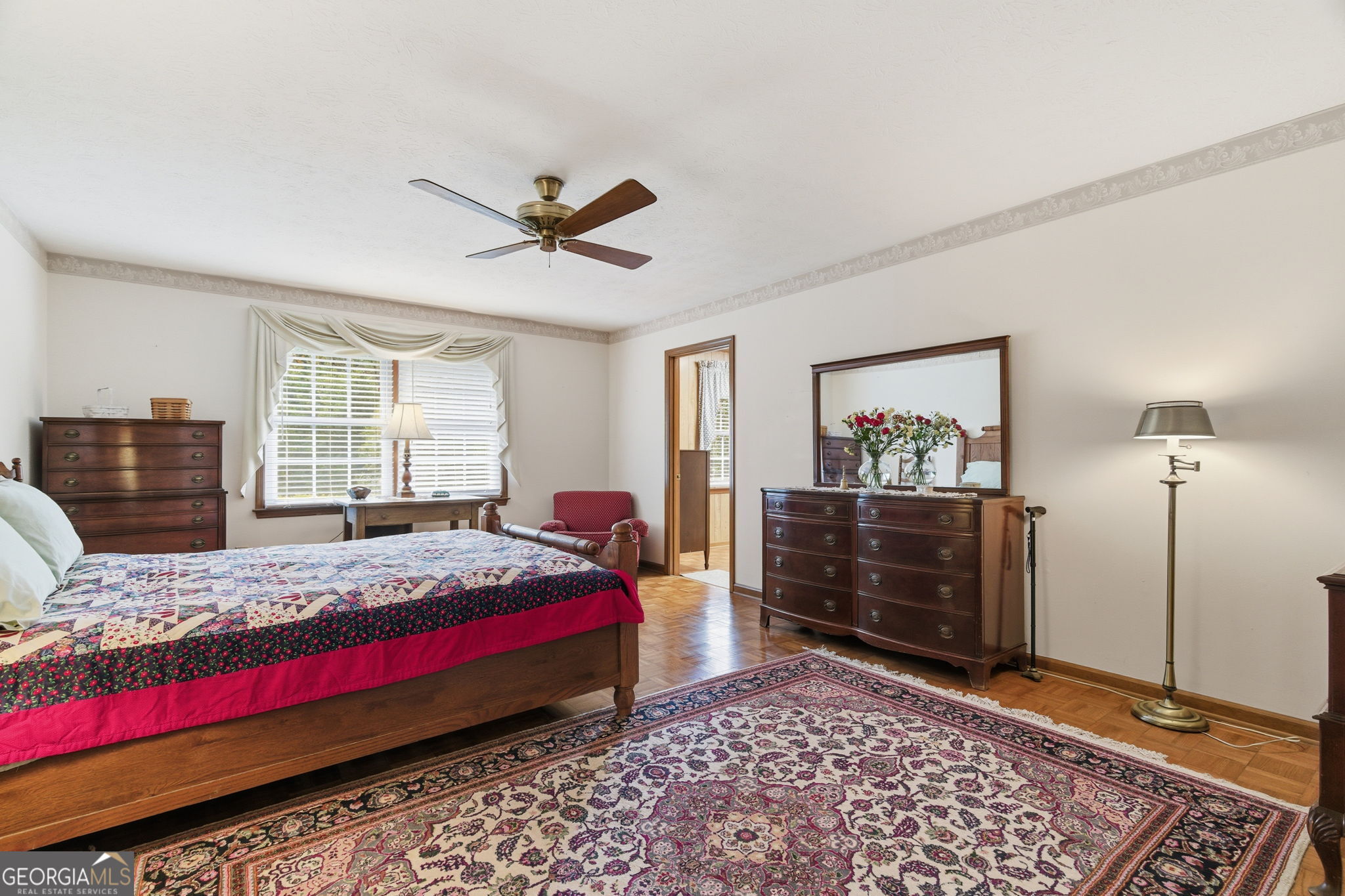 91 Almond Road LaGrange, GA 30241 - Photo 43 of 46 a bedroom with a bed and wooden floor