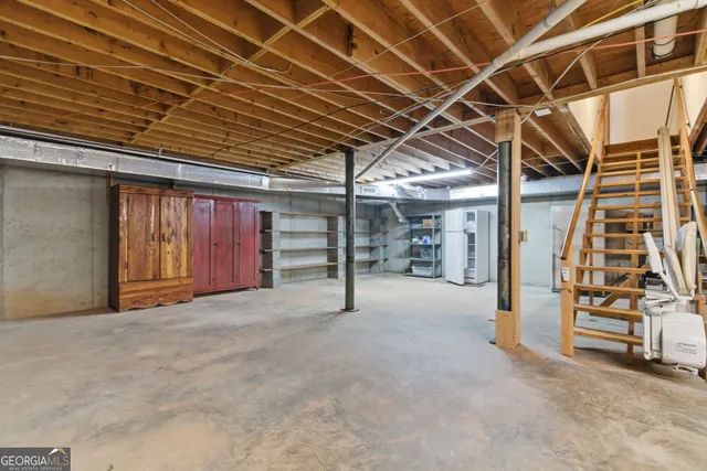 a view of an empty room with stairs