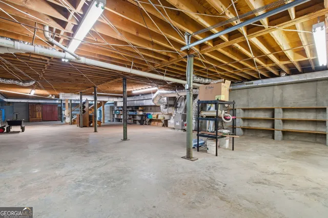 a view of a dining room with furniture and window