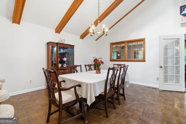a view of hallway with wooden floor