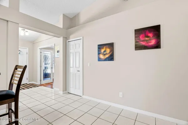 a view of a livingroom with furniture and staircase