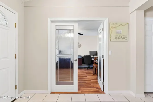 a view of a bedroom from a hallway
