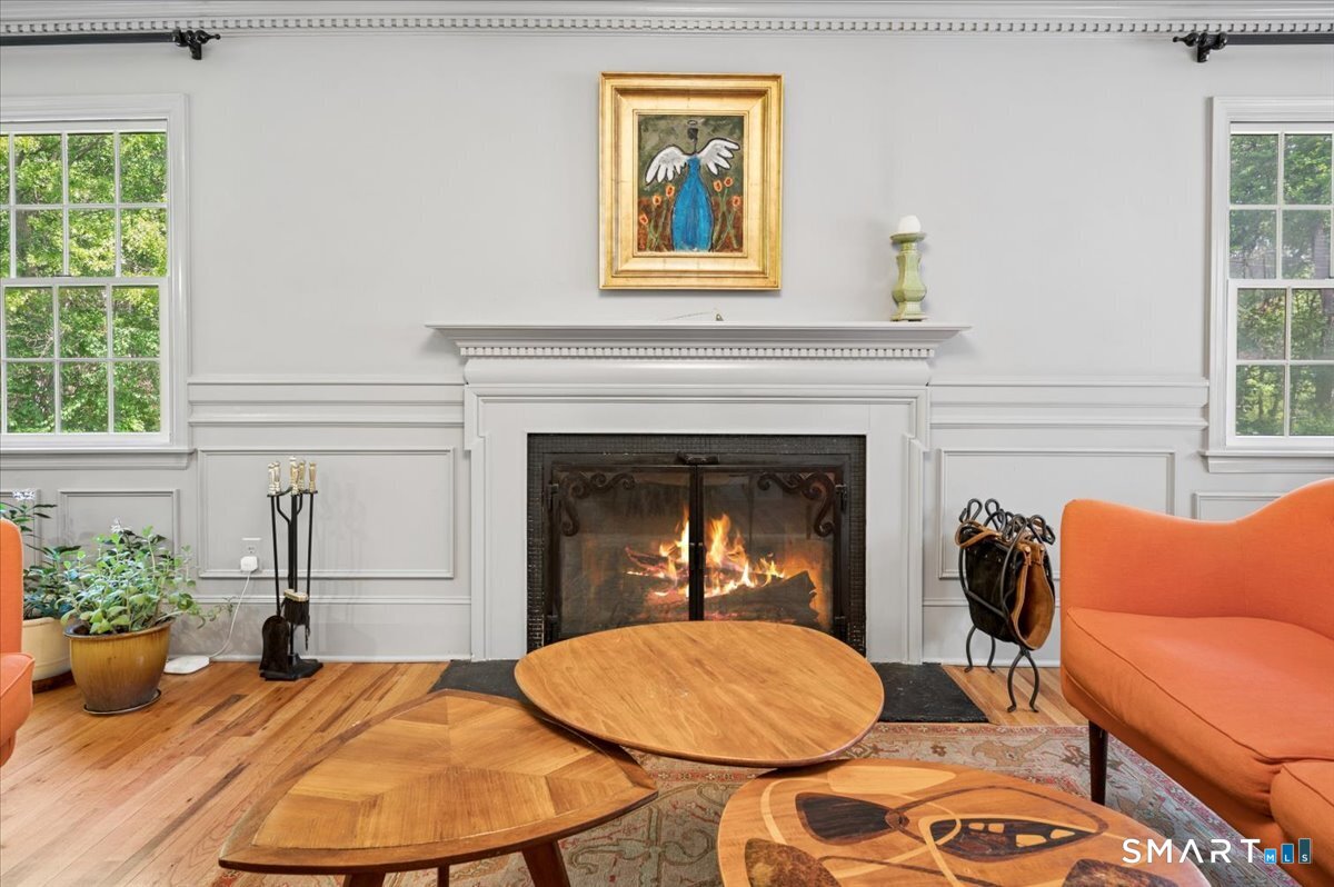 94 Vista Road Wilton, CT 06897 - Photo 6 of 38 a living room with furniture and a fireplace