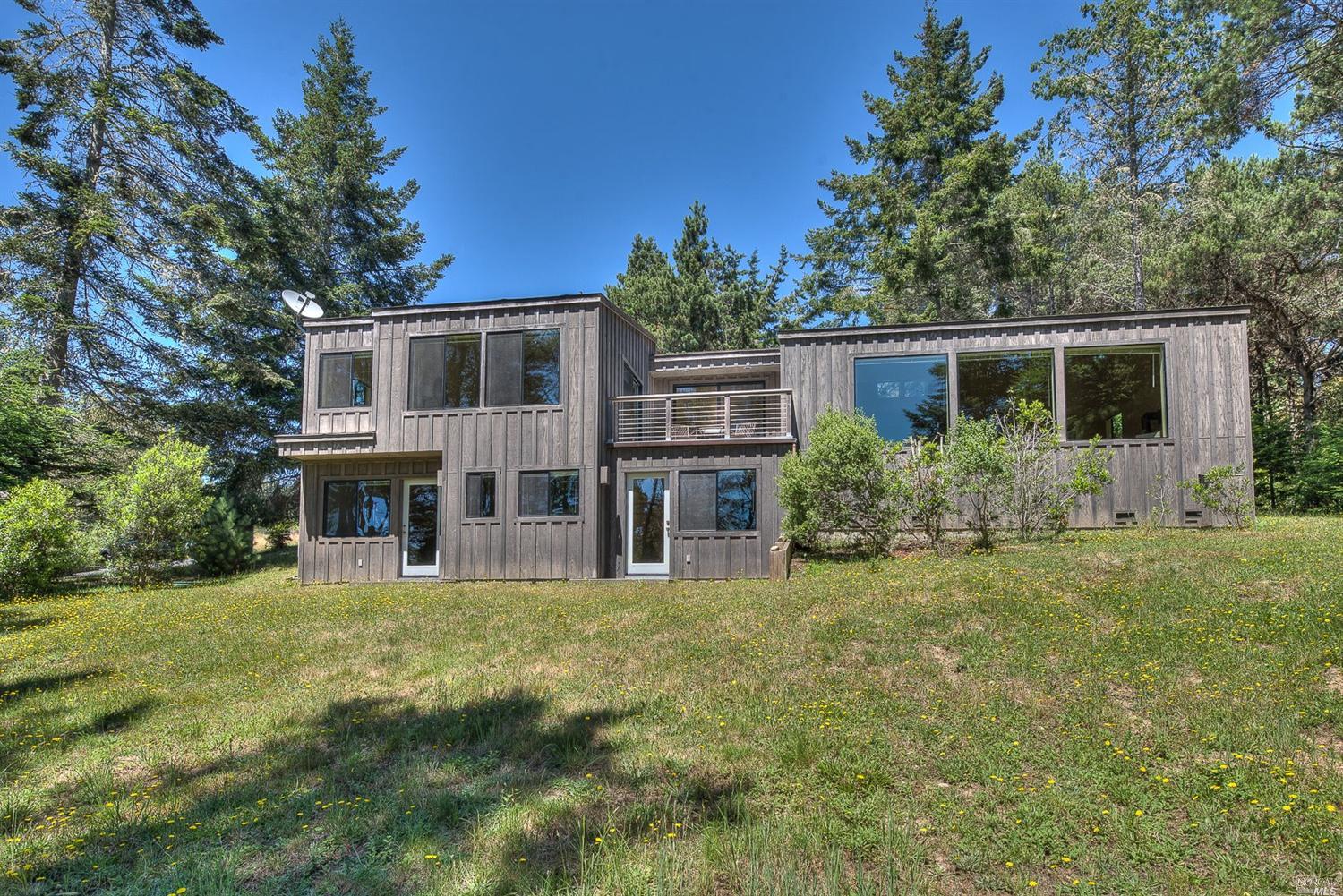 41200 Annapolis Road The Sea Ranch, CA 95497 - Photo 1 of 1 a view of a house with yard and sitting area