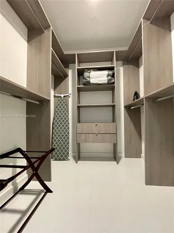 a living room with a couch and a rug