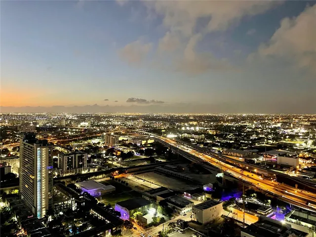 a view of a swimming pool with chairs